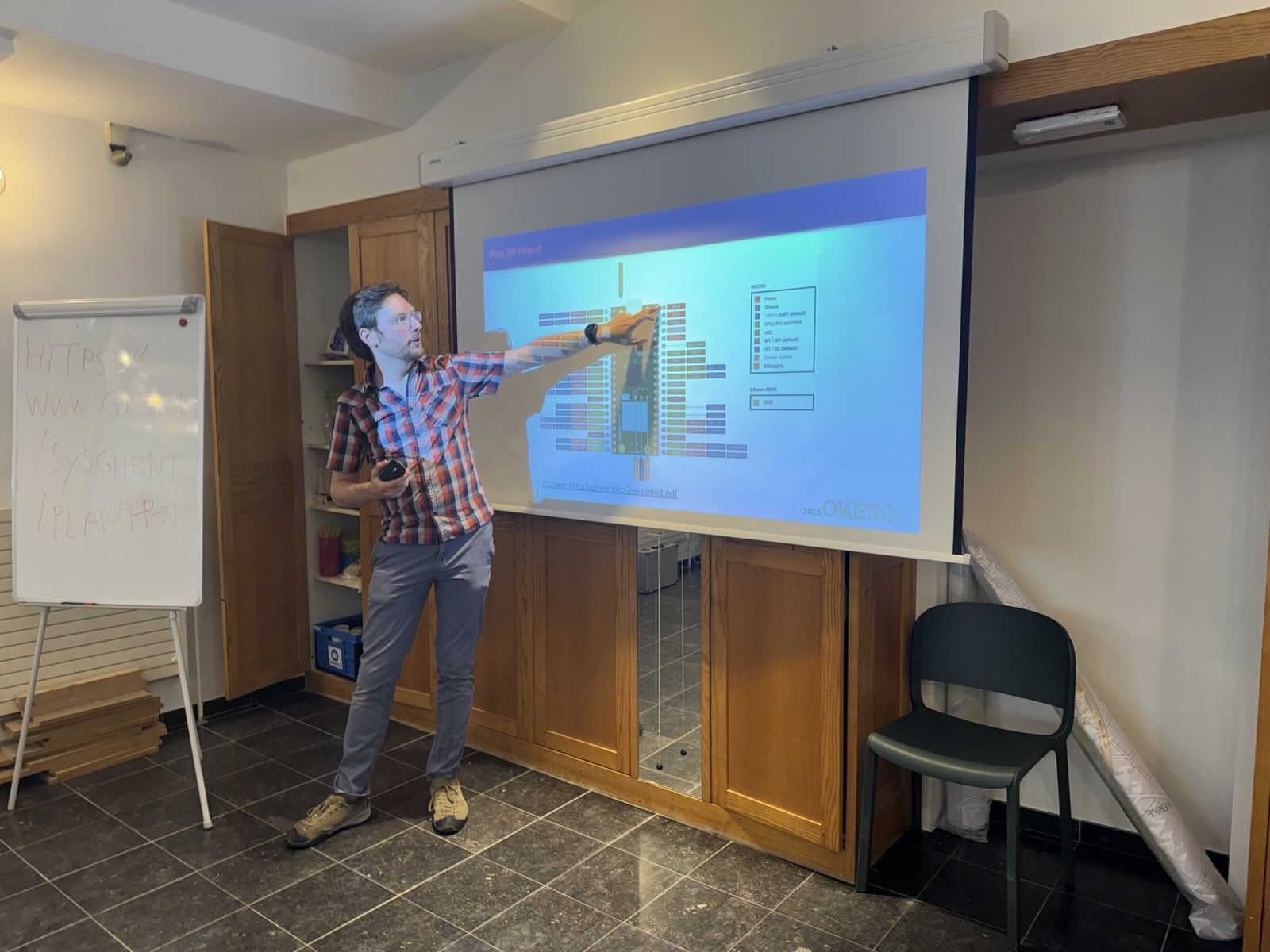 Hugo pointing at slides